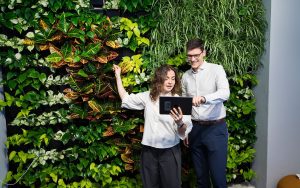 Plantwall Plants Women and Man Working Tablet
