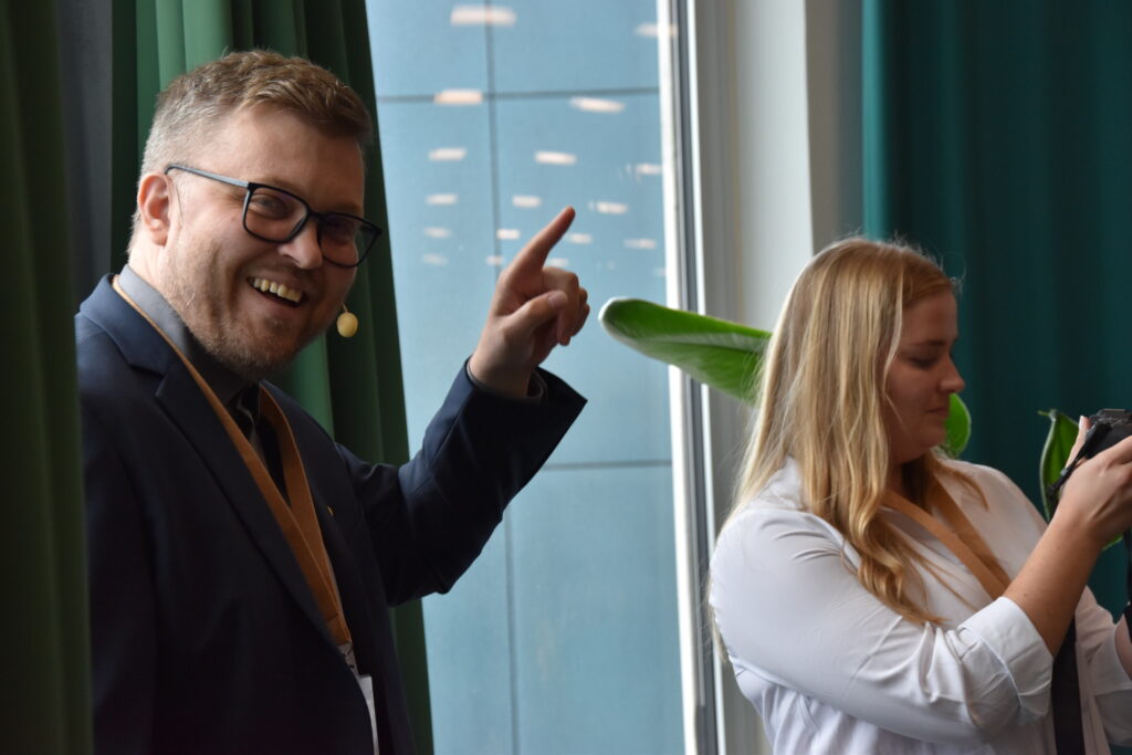 Speaker smiling during Flow of Plastic