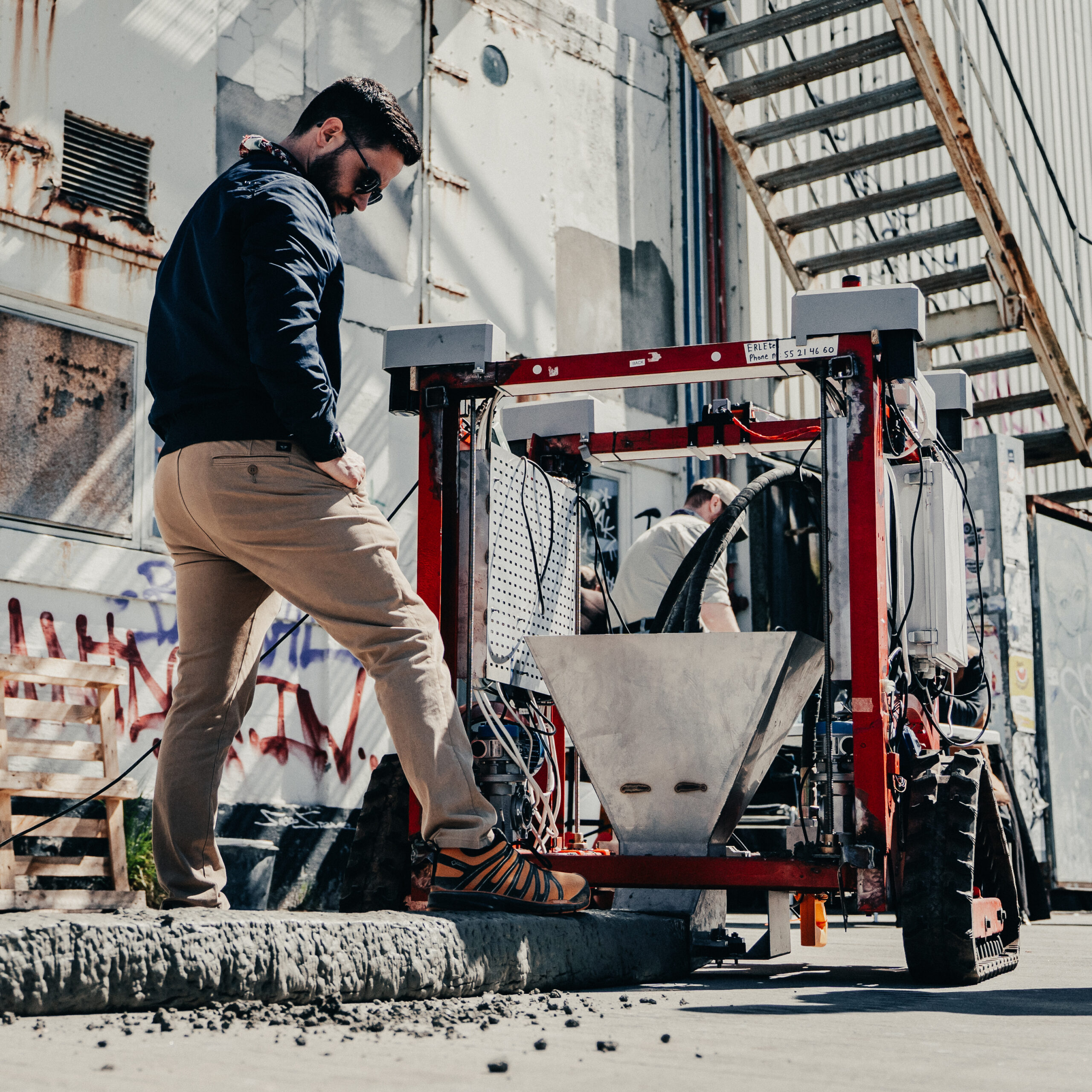 Medium large robot 3D printing a wall for flood protection